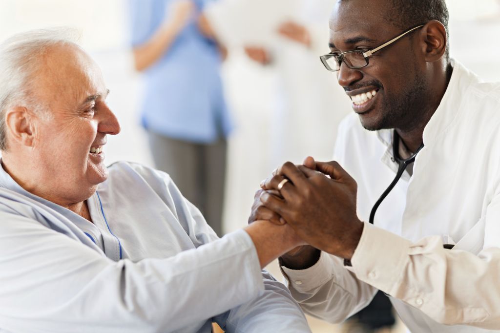 Male doctor with senior patient