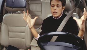 Frustrated woman driving car