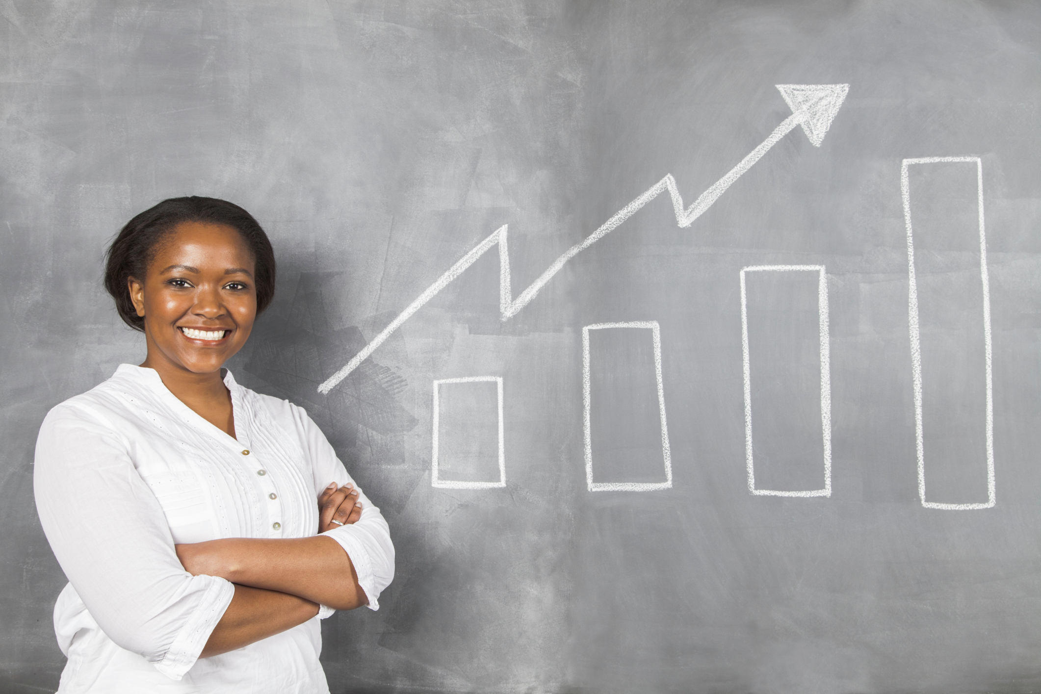 Happy african woman proud of her savings growth.