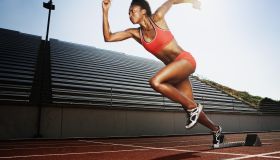 Women running on athletic track