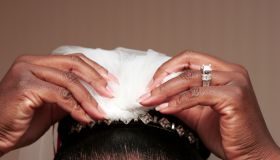 Detail of African-American bride putting on her tiara