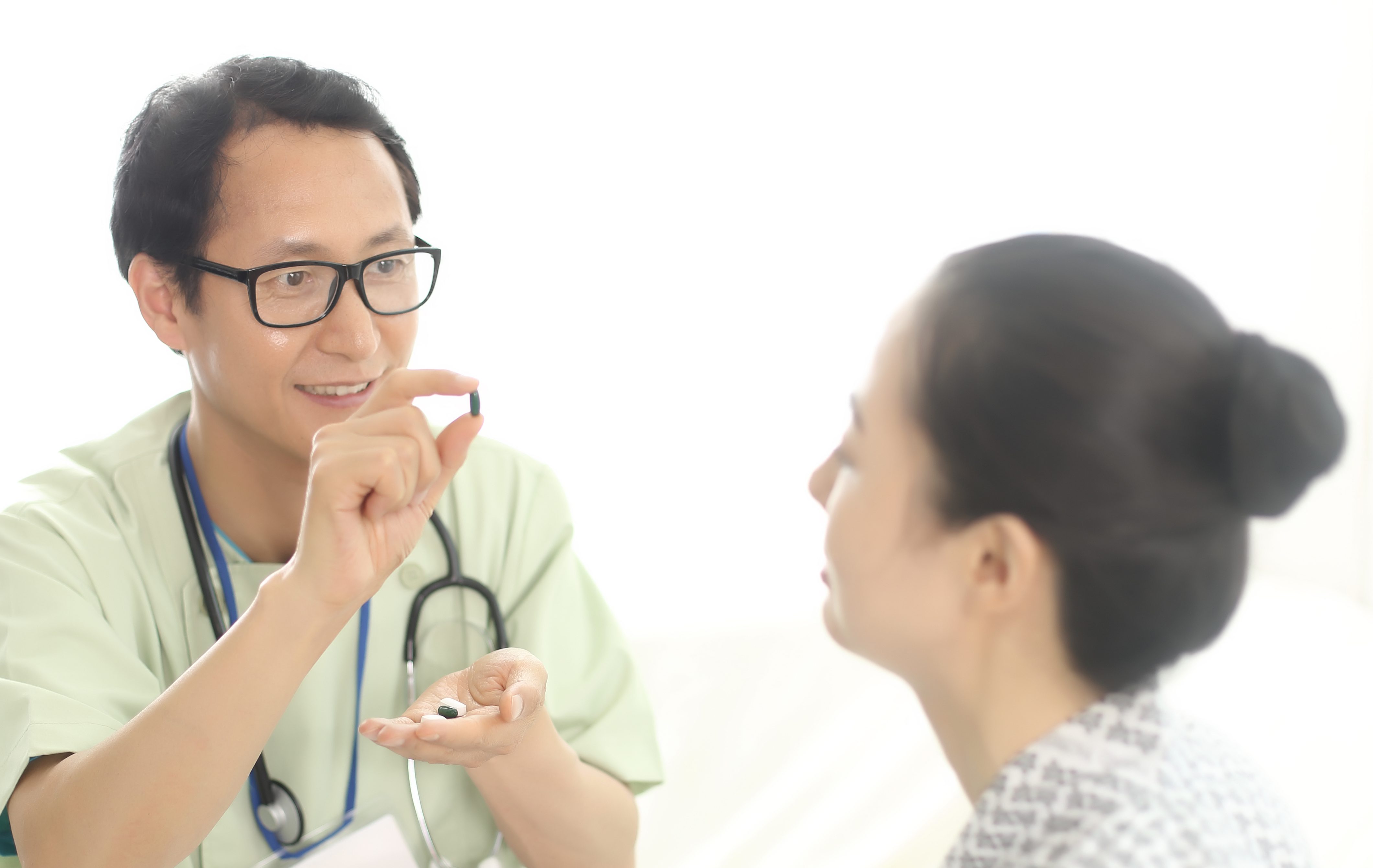 Doctor talking with patient about medicine side effects