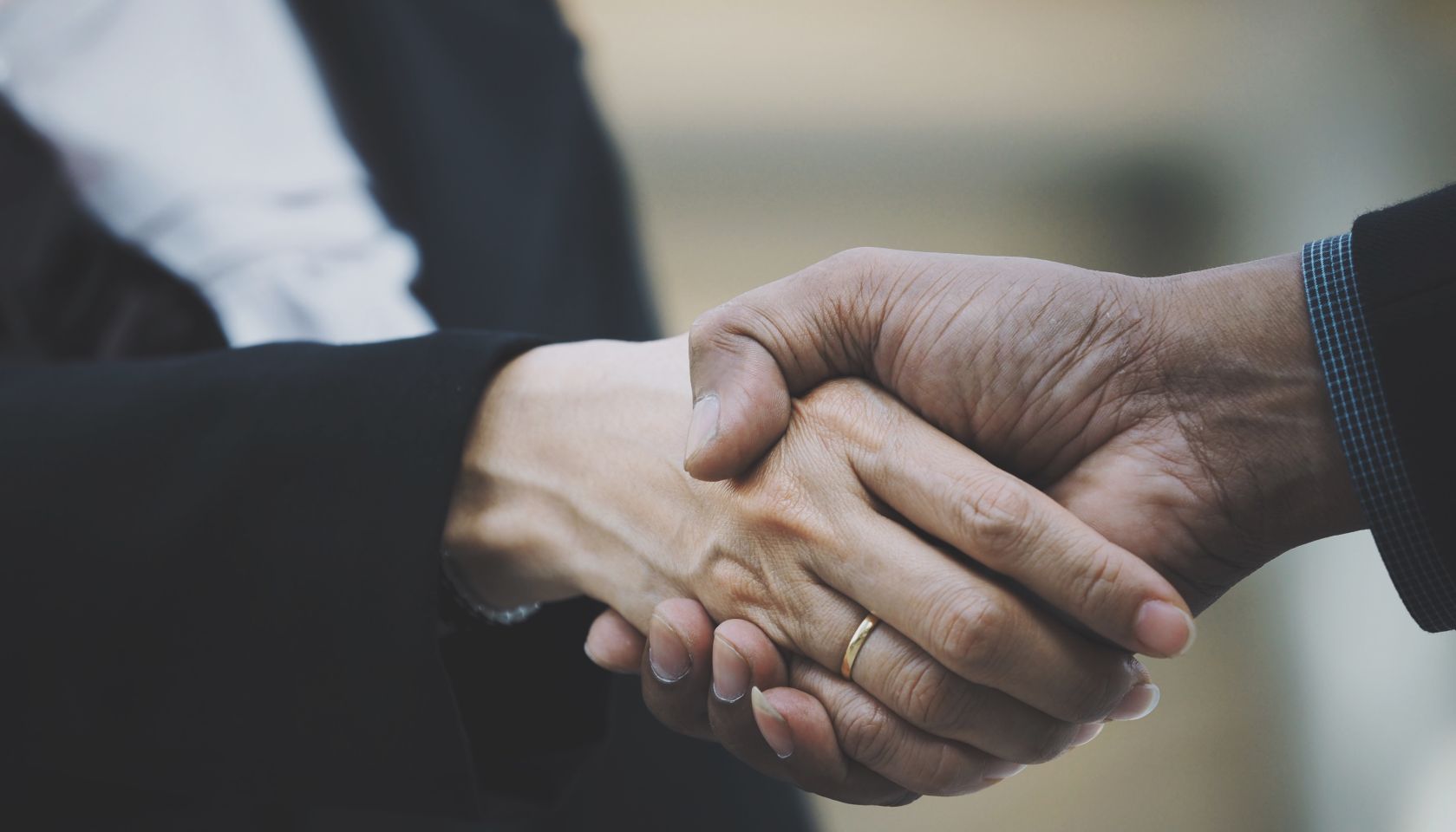 Close-Up Of People Doing Handshake