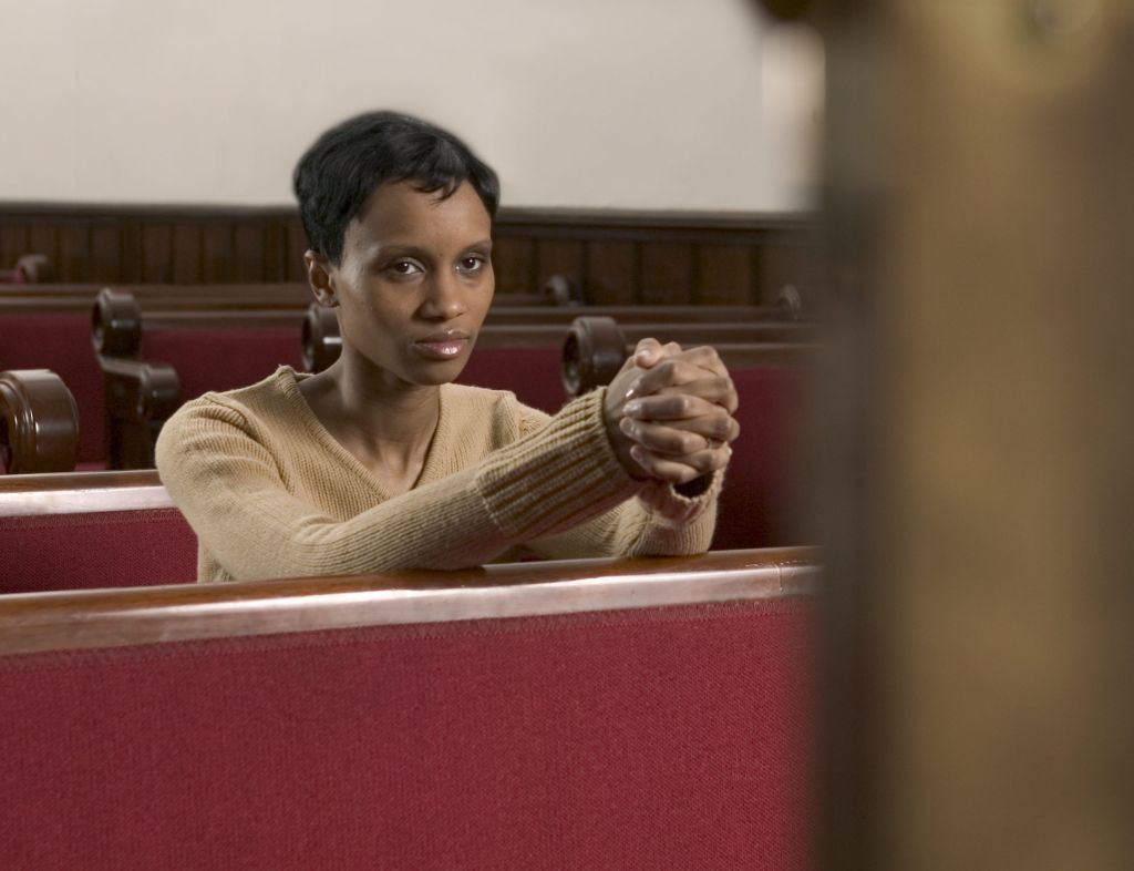 Woman Praying in Church