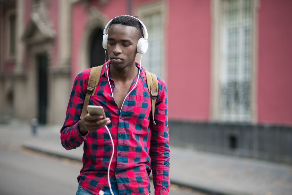 African teenager using mobile phone