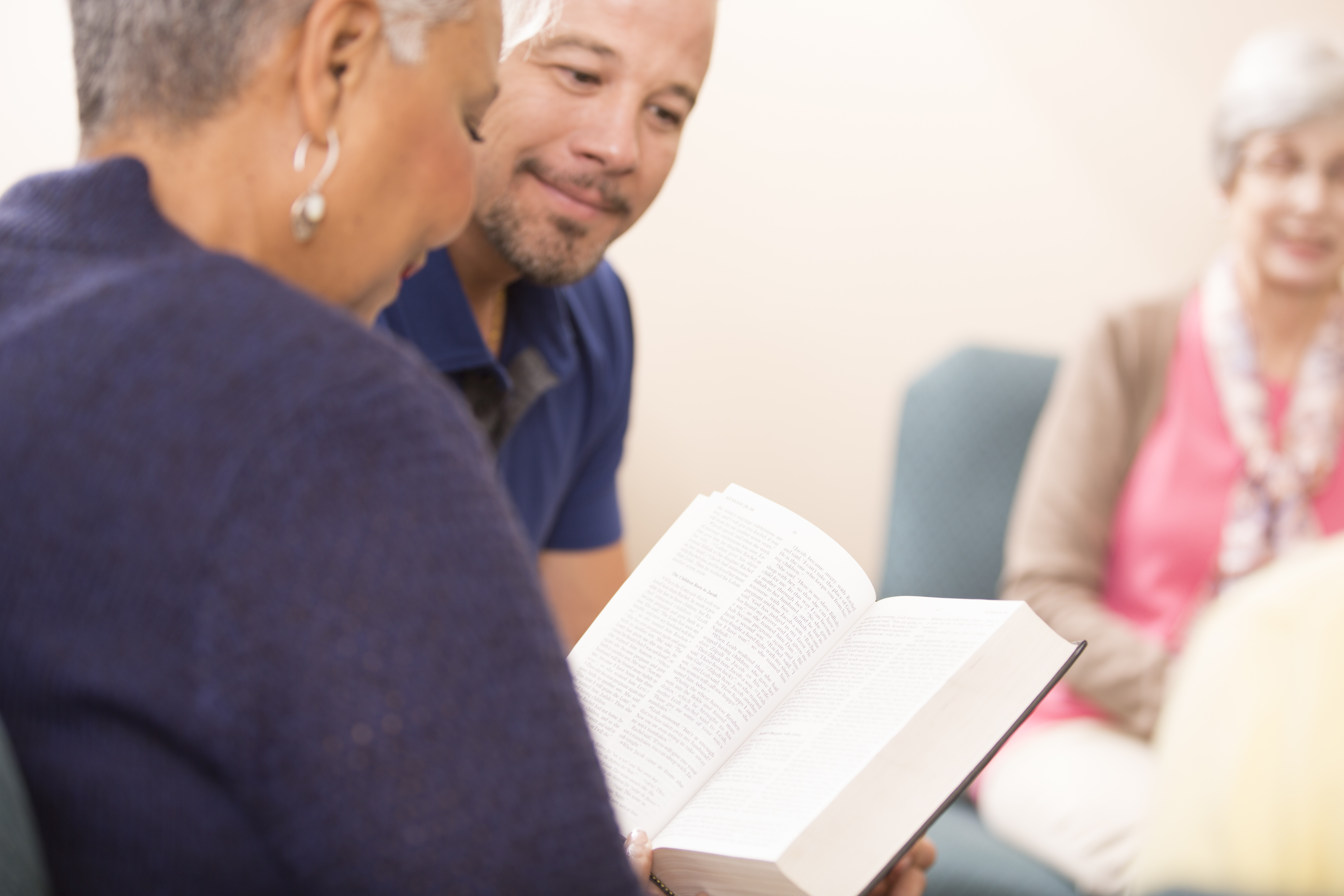 Multi-ethnic, mixed age bible study group.