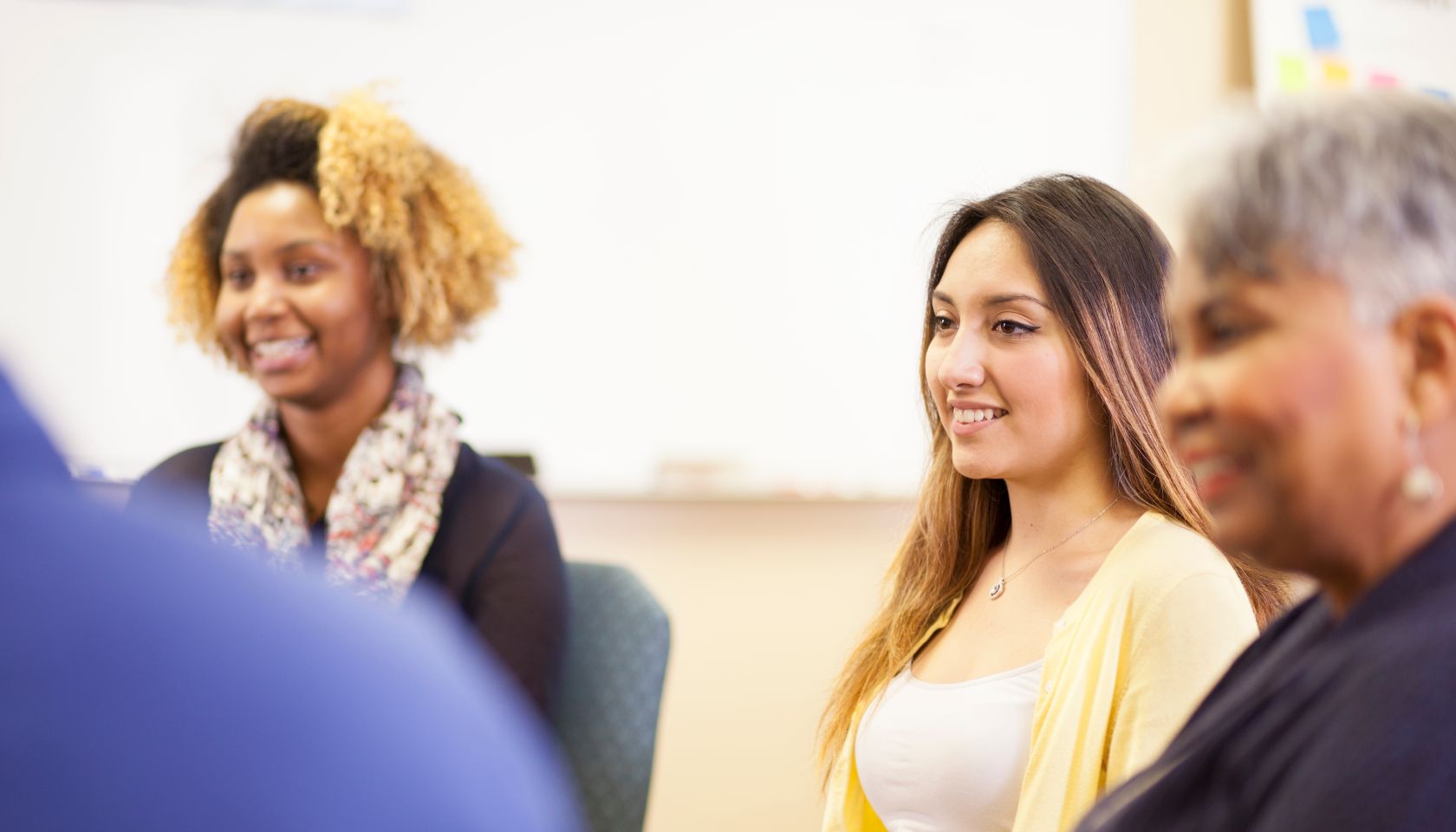Multi-ethnic group counseling session, support meeting.
