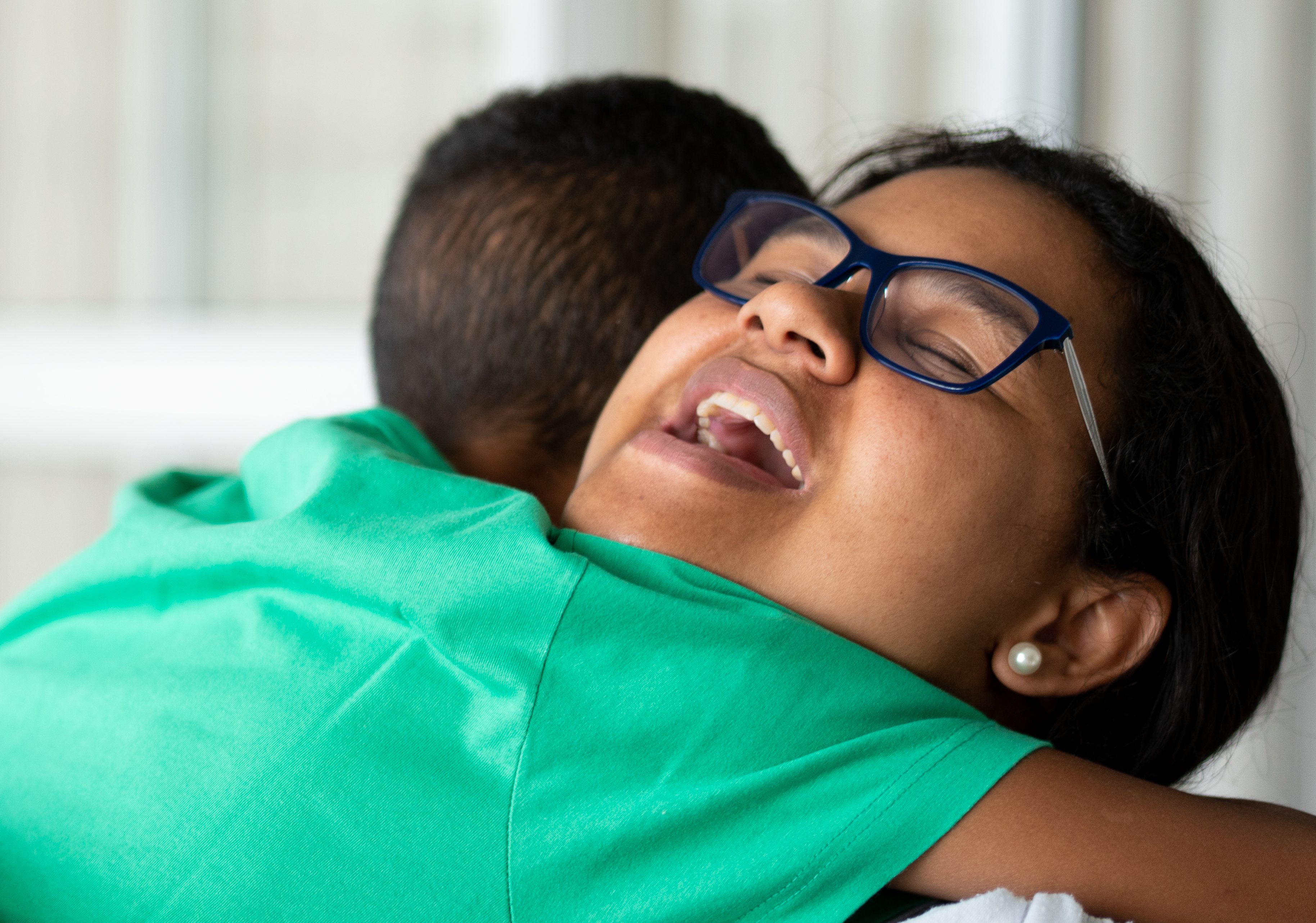 Mother and son embracing and receiving gifts - Mothers Or Children's Day