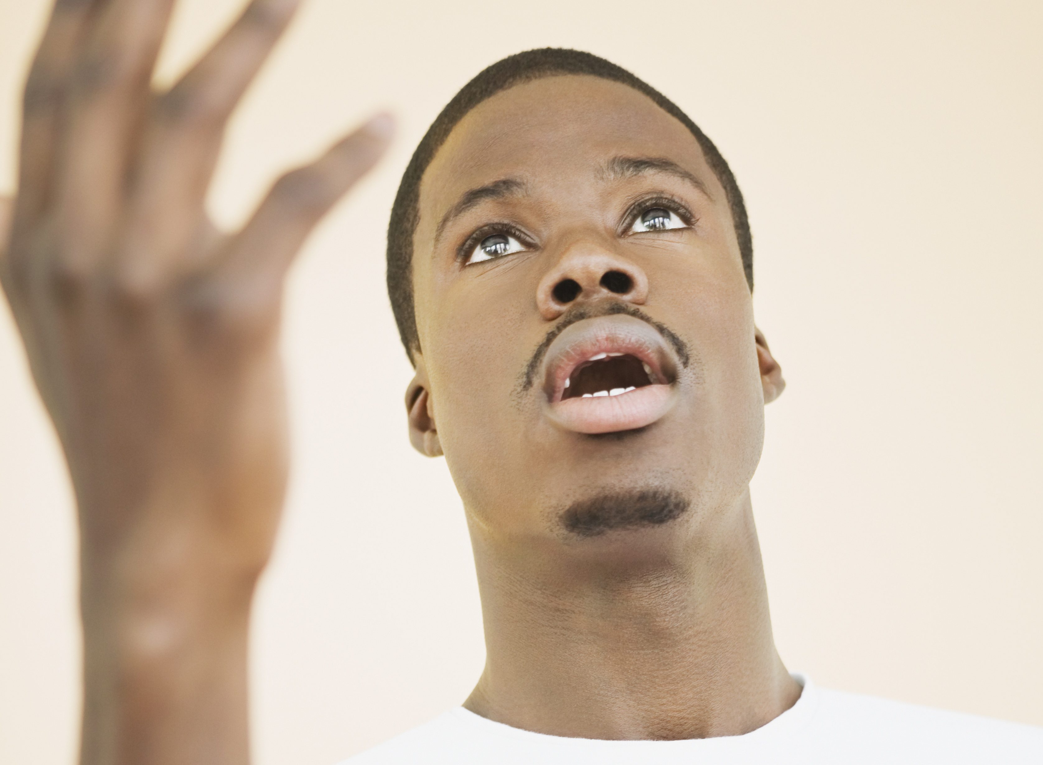 African man singing in church choir gown