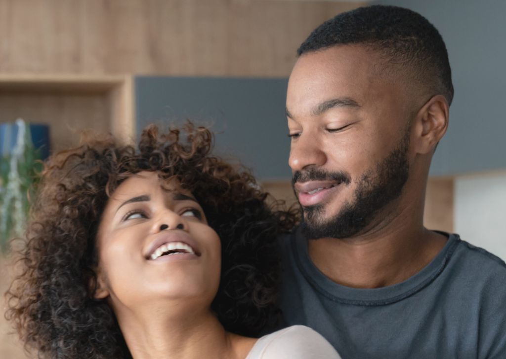 Happy African American couple at home