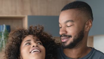 Happy African American couple at home