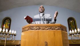 African American Reverend preaching in church
