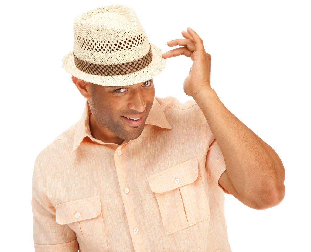 Sexy African American man showing off wearing a summer hat