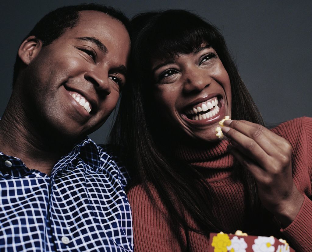 Laughing Couple Watching Movie