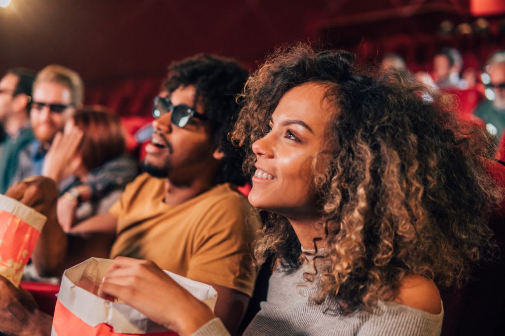 Smiling woman watching a movie