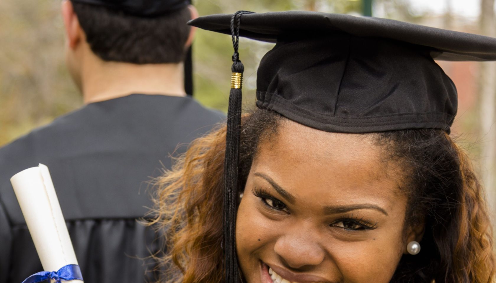 African descent college student at college graduation.