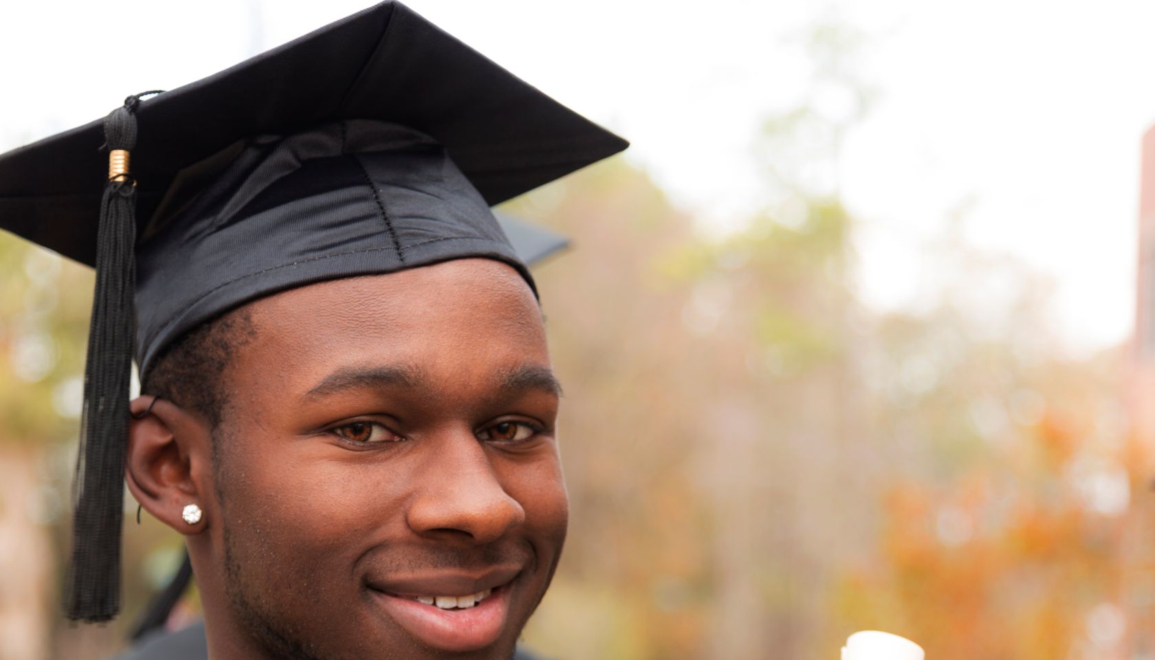 African descent college student at college graduation.