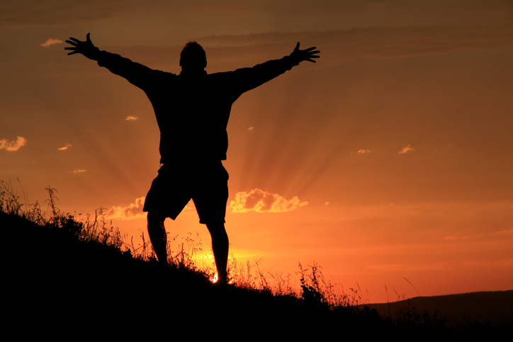 Man celebrates climbing stop mountain
