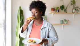 Woman eating healthy breakfast at home