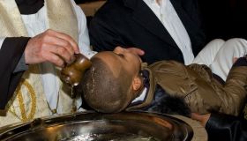 Baptism of an African boy. Legnano. Italy