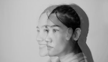 Double exposure of close-up of asian beautiful woman who internally suffering from dissociative identity disorder. Bipolar and Depression woman.