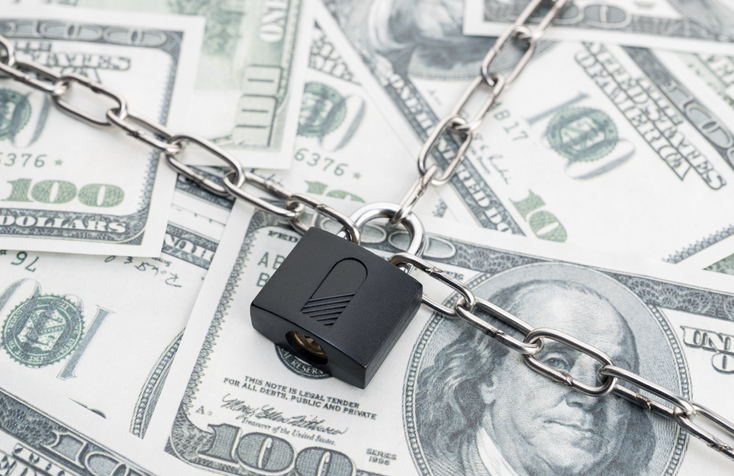Lock security and chain on dollar banknotes background